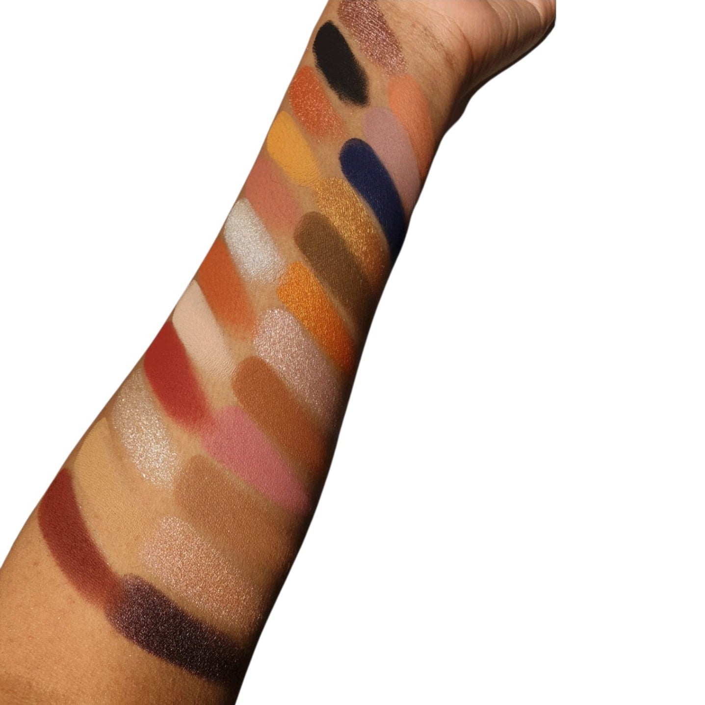 SKIN jigsaw puzzle eyeshadow palette arm swatches on brown olive skin